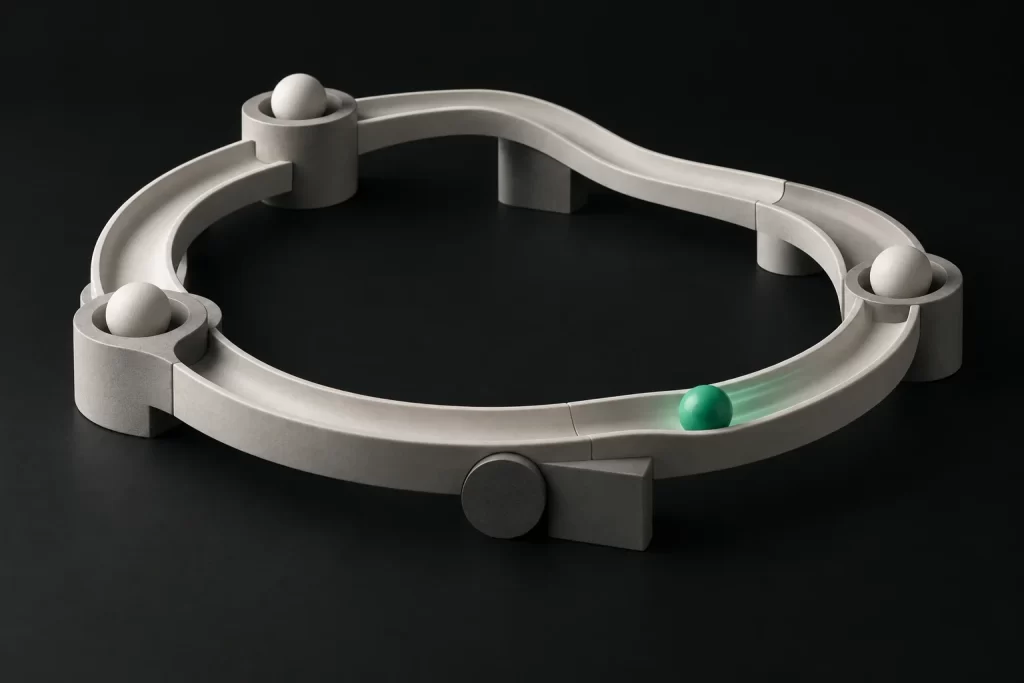 A closed ceramic loop track with white spheres and one green sphere in motion